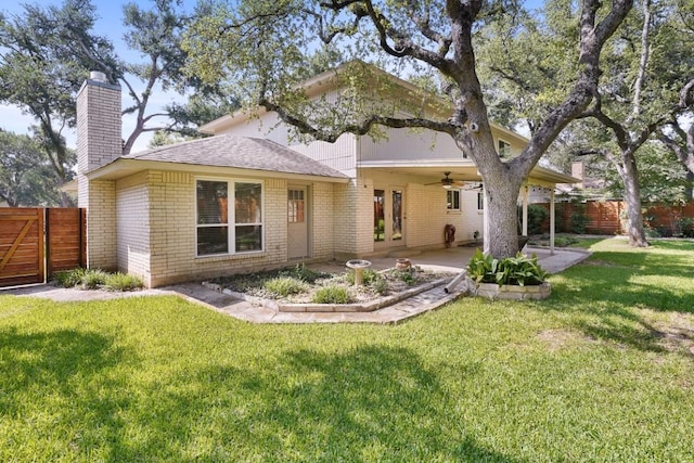11204 Deadoak Ln, Austin, TX 78759 - rear view of house featuring a ceiling fan, a chimney, a patio area, and brick siding