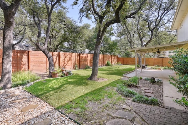 11204 Deadoak Ln, Austin, TX 78759 - fenced backyard with a patio and a ceiling fan
