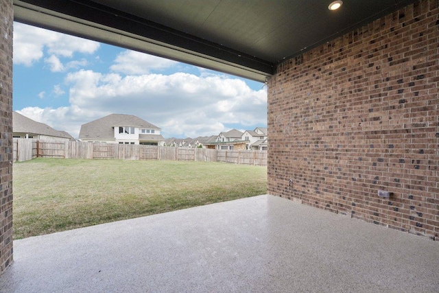 view of patio featuring a fenced backyard and a residential view