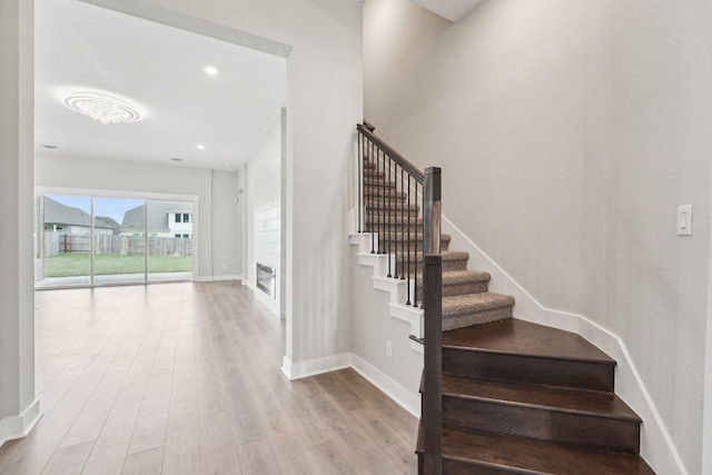 stairs featuring baseboards and wood finished floors
