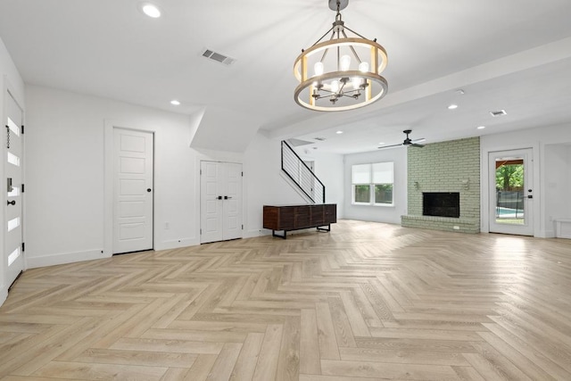 6905 Drexel Dr, Austin, TX 78723 - unfurnished living room with healthy amount of natural light, a chandelier, ceiling fan, a brick fireplace, and recessed lighting