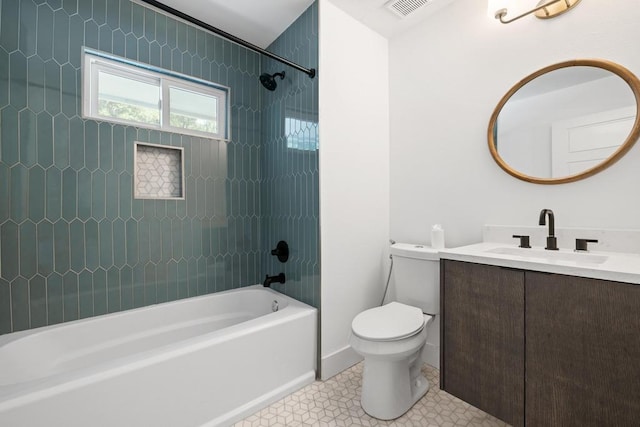 6905 Drexel Dr, Austin, TX 78723 - full bathroom featuring toilet, bathing tub / shower combination, vanity, tile patterned flooring, and baseboards