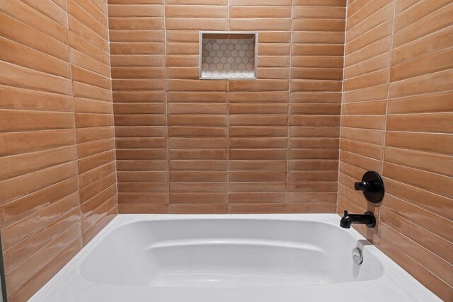 bathroom featuring  shower combination