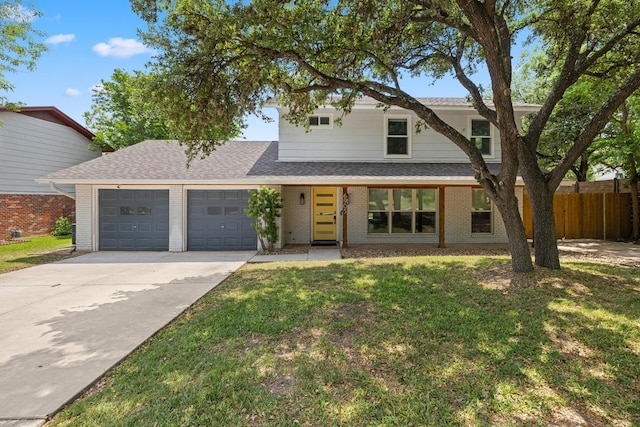 6905 Drexel Dr, Austin, TX 78723 - view of front of home featuring a garage, brick siding, and concrete driveway