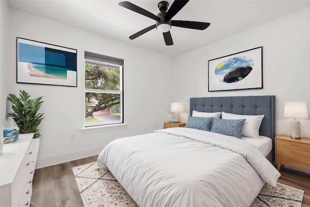 6905 Drexel Dr, Austin, TX 78723 - bedroom featuring wood finished floors, baseboards, and ceiling fan