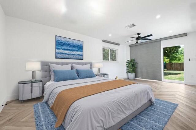 bedroom featuring baseboards, visible vents, access to outside, and multiple windows