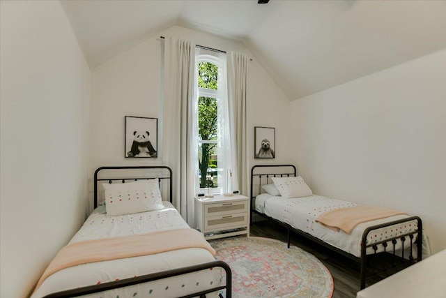 bedroom featuring vaulted ceiling and wood finished floors