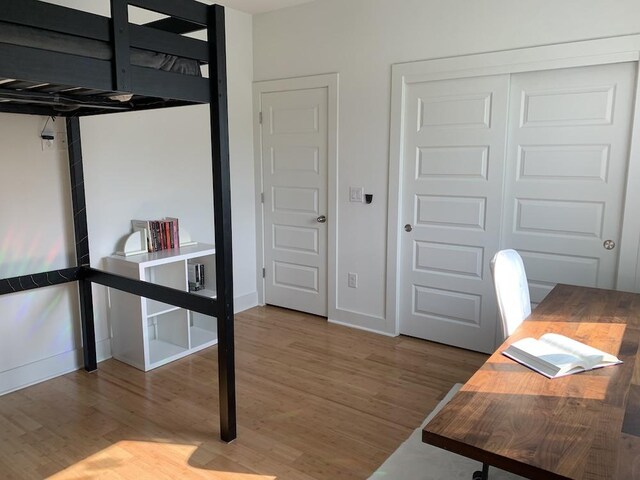office featuring baseboards and wood finished floors