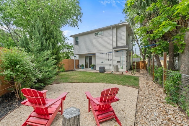 back of house featuring a patio area, central air condition unit, and a fenced backyard