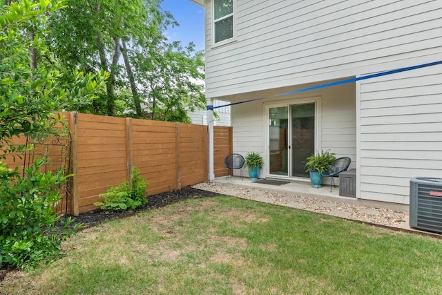 view of yard with fence and cooling unit