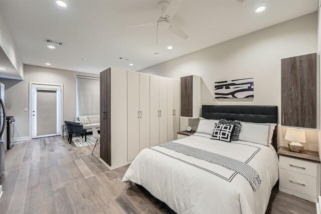 bedroom featuring recessed lighting, visible vents, and light wood finished floors