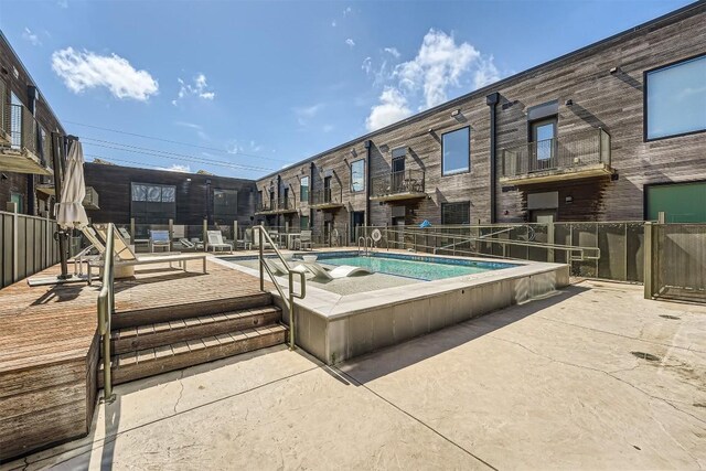 view of pool featuring fence