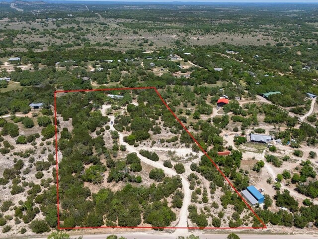 birds eye view of property featuring a rural view