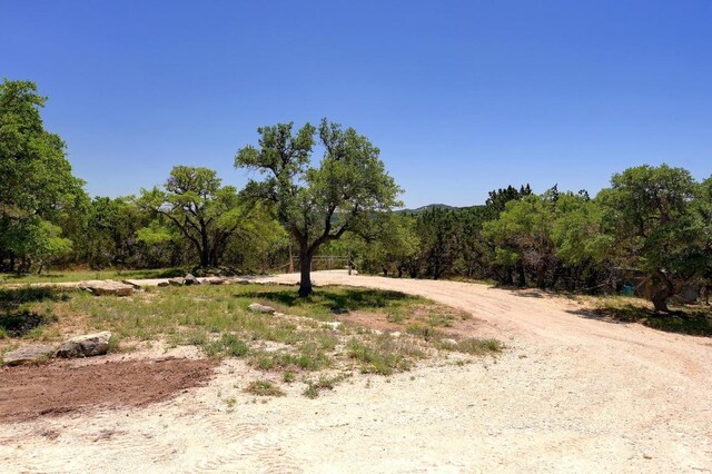 view of landscape featuring a wooded view