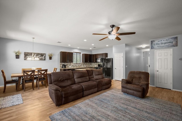 15204 Guffey Dr, Austin, TX 78725 - living room with ceiling fan, light wood-style flooring, and recessed lighting