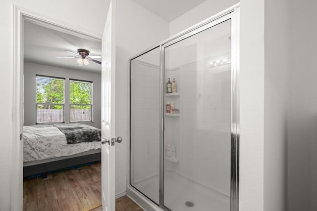 15204 Guffey Dr, Austin, TX 78725 - ensuite bathroom featuring a shower stall, ceiling fan, and wood finished floors