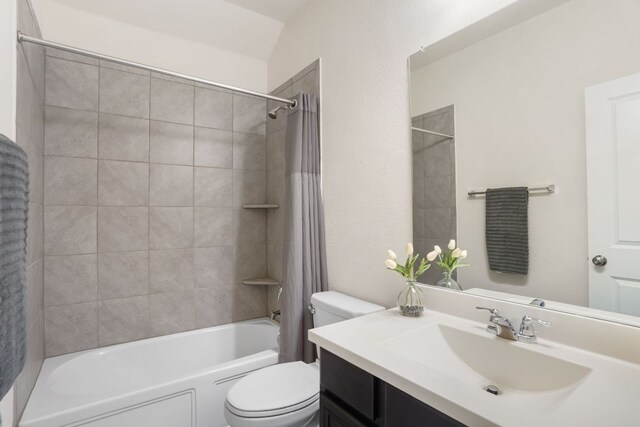 bathroom with shower / tub combo, toilet, and vanity
