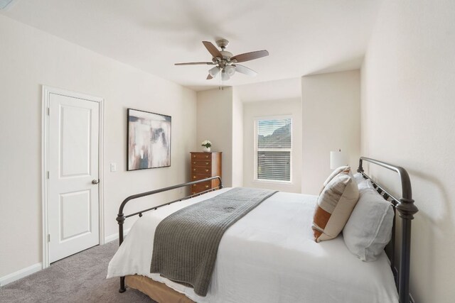 bedroom with baseboards, carpet floors, and ceiling fan