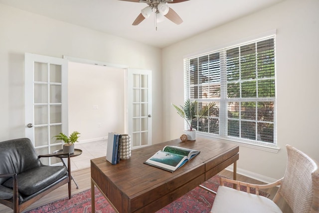 home office featuring baseboards, a ceiling fan, french doors, and light tile patterned flooring