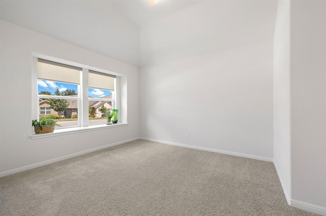 unfurnished room with carpet and baseboards