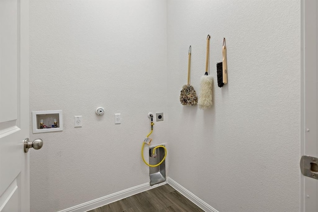 laundry room with hookup for an electric dryer, dark wood-style flooring, baseboards, hookup for a gas dryer, and laundry area