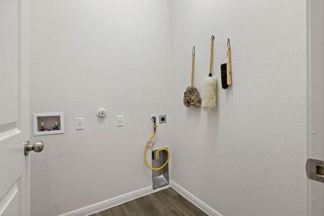 220 Falling Star Ln, Georgetown, TX 78628 - laundry room featuring electric dryer hookup, hookup for a gas dryer, dark wood finished floors, hookup for a washing machine, and baseboards