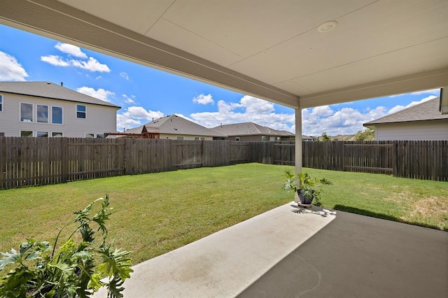 view of yard with a patio area and a fenced backyard