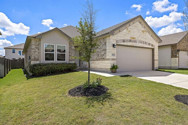 view of front of home with fence, a front lawn, concrete driveway, stone siding, and a garage