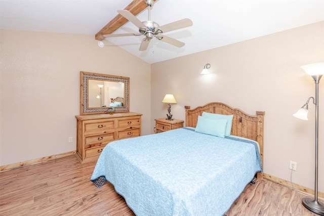 bedroom with lofted ceiling with beams, a ceiling fan, baseboards, and light wood-style floors