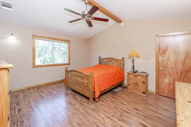 bedroom with lofted ceiling with beams, baseboards, visible vents, light wood-style floors, and ceiling fan
