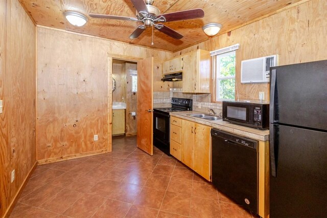 kitchen with a ceiling fan, a sink, black appliances, light countertops, and under cabinet range hood