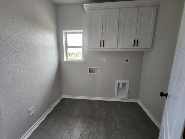 701 Eagle Claw Dr, Salado, TX 76571 - washroom with baseboards, dark wood-style floors, hookup for an electric dryer, and cabinet space