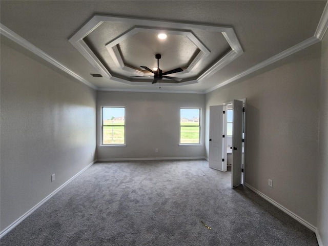 701 Eagle Claw Dr, Salado, TX 76571 - unfurnished room with a ceiling fan, a raised ceiling, dark carpet, baseboards, and ornamental molding