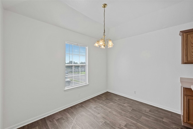 3201 El Salido Pkwy Bldg E, Cedar Park, TX 78613 - unfurnished dining area featuring dark wood-type flooring, baseboards, and a notable chandelier
