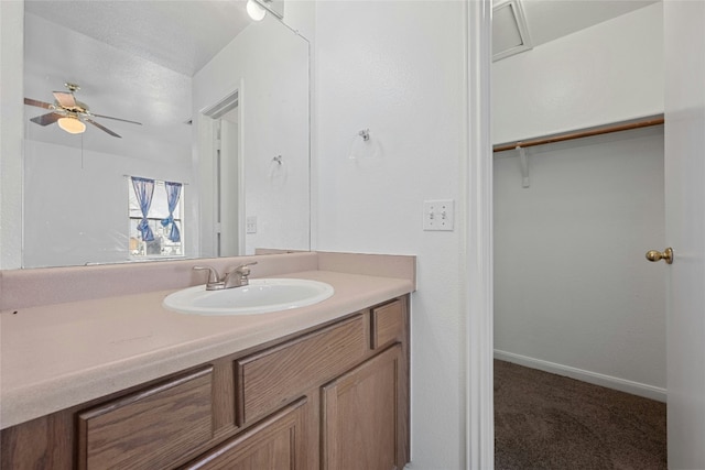 3201 El Salido Pkwy Bldg E, Cedar Park, TX 78613 - bathroom featuring baseboards, vanity, and ceiling fan