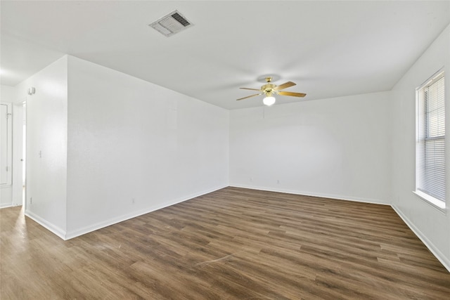 3201 El Salido Pkwy Bldg E, Cedar Park, TX 78613 - empty room featuring dark wood finished floors, visible vents, a ceiling fan, and baseboards