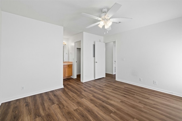 3201 El Salido Pkwy Bldg E, Cedar Park, TX 78613 - unfurnished bedroom featuring dark wood finished floors, baseboards, ceiling fan, and connected bathroom