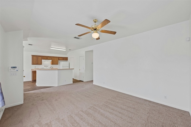 3201 El Salido Pkwy Bldg E, Cedar Park, TX 78613 - unfurnished living room featuring carpet, visible vents, baseboards, and ceiling fan