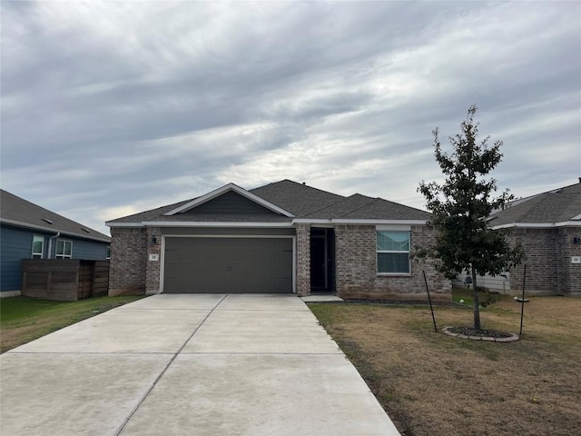 110 Madrid, Kyle, TX 78640 - single story home featuring brick siding, a garage, driveway, and a shingled roof