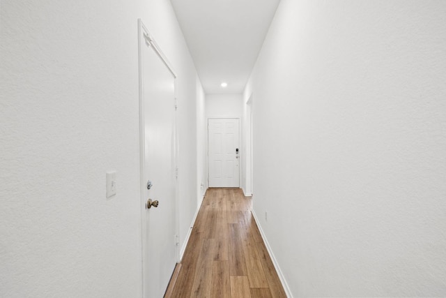 110 Madrid, Kyle, TX 78640 - hallway featuring baseboards, recessed lighting, and light wood-style flooring