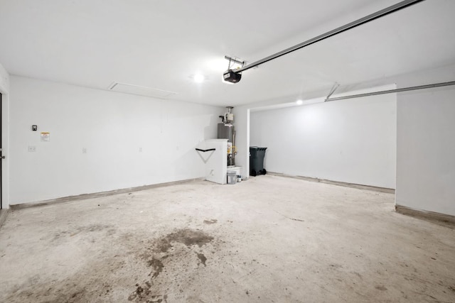 110 Madrid, Kyle, TX 78640 - garage featuring a garage door opener and water heater