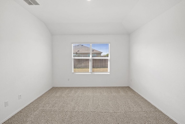 110 Madrid, Kyle, TX 78640 - spare room featuring lofted ceiling, carpet flooring, and baseboards