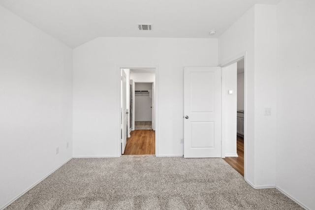 110 Madrid, Kyle, TX 78640 - unfurnished bedroom with carpet flooring, baseboards, and a spacious closet