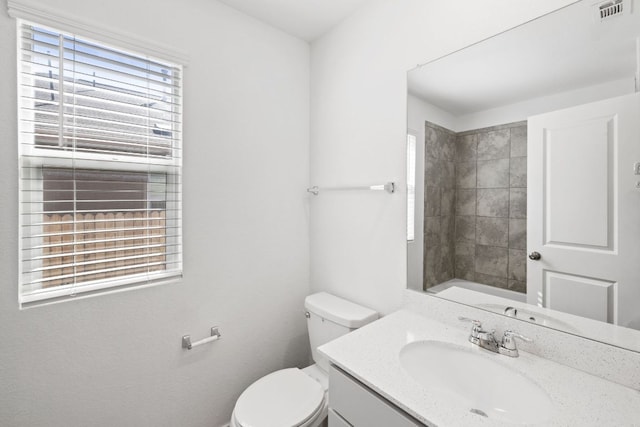 110 Madrid, Kyle, TX 78640 - bathroom featuring vanity, toilet, and a shower