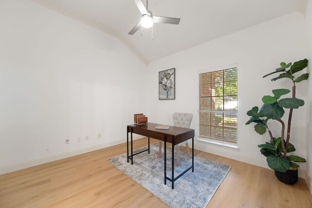 home office with lofted ceiling, wood finished floors, baseboards, and ceiling fan