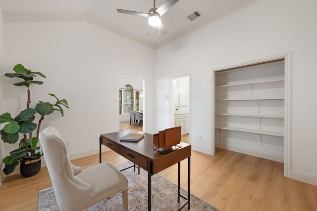 office featuring ceiling fan, baseboards, light wood-style floors, and visible vents