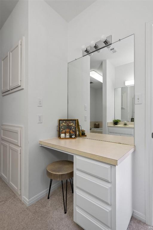 bathroom with baseboards