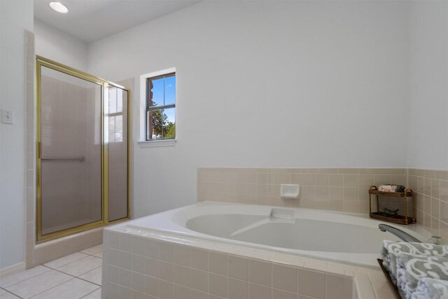 full bathroom with a shower stall, a garden tub, and tile patterned floors