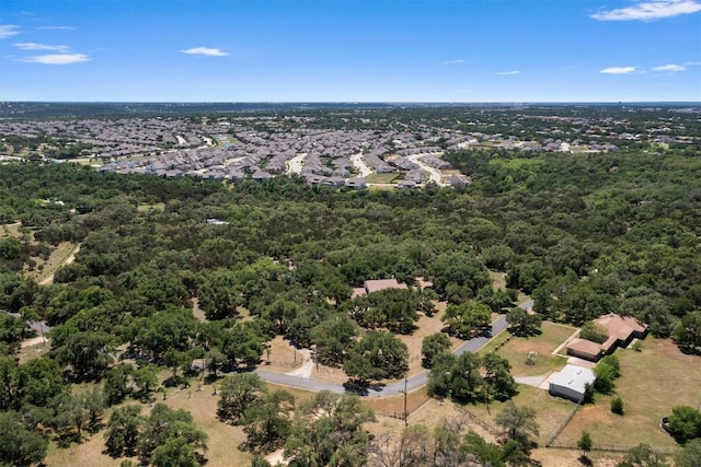 bird's eye view featuring a forest view