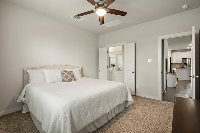 bedroom featuring stainless steel fridge with ice dispenser, carpet flooring, visible vents, and baseboards